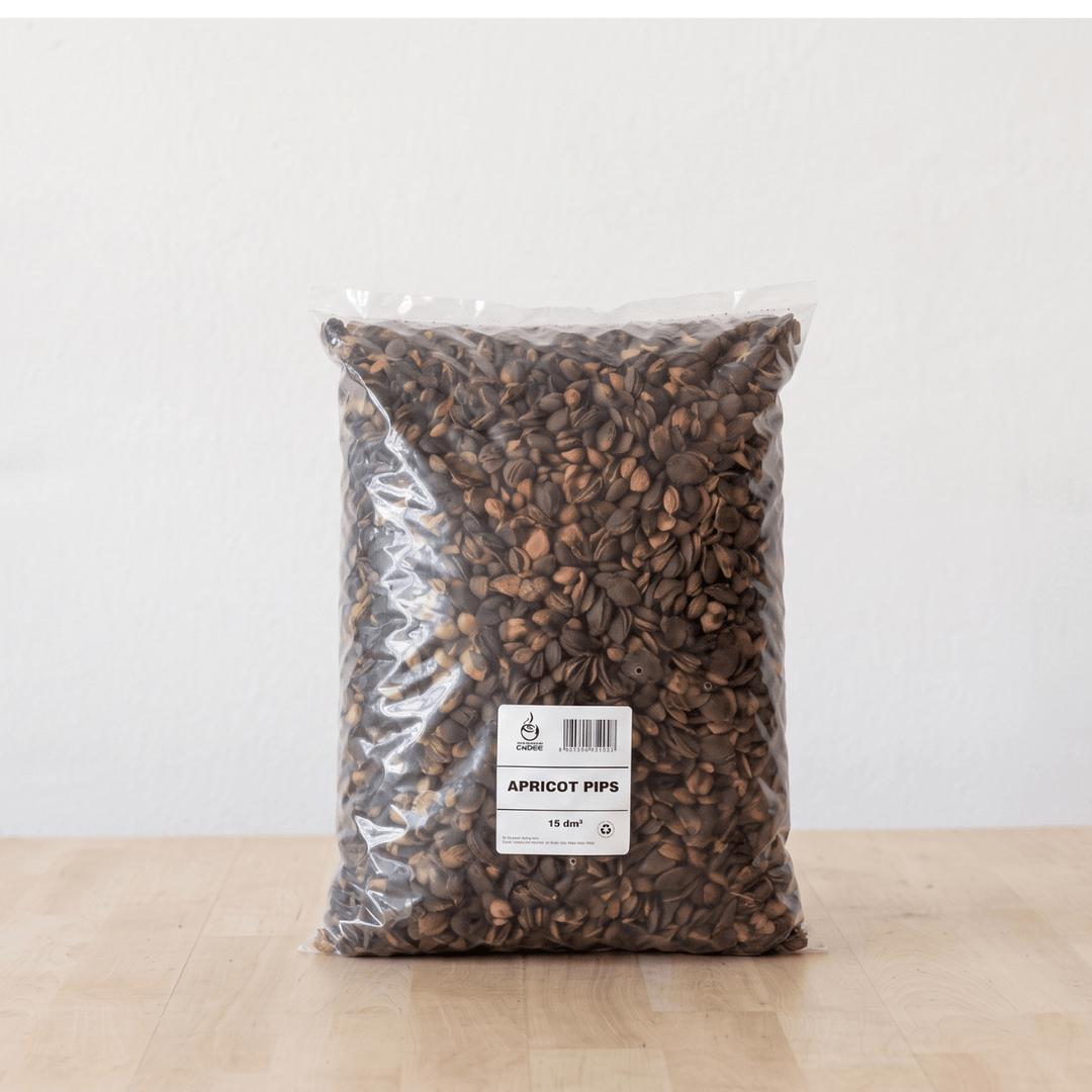 A bag of Apricot Pips, a natural soil topper for pots, providing moisture retention and a neat finish.