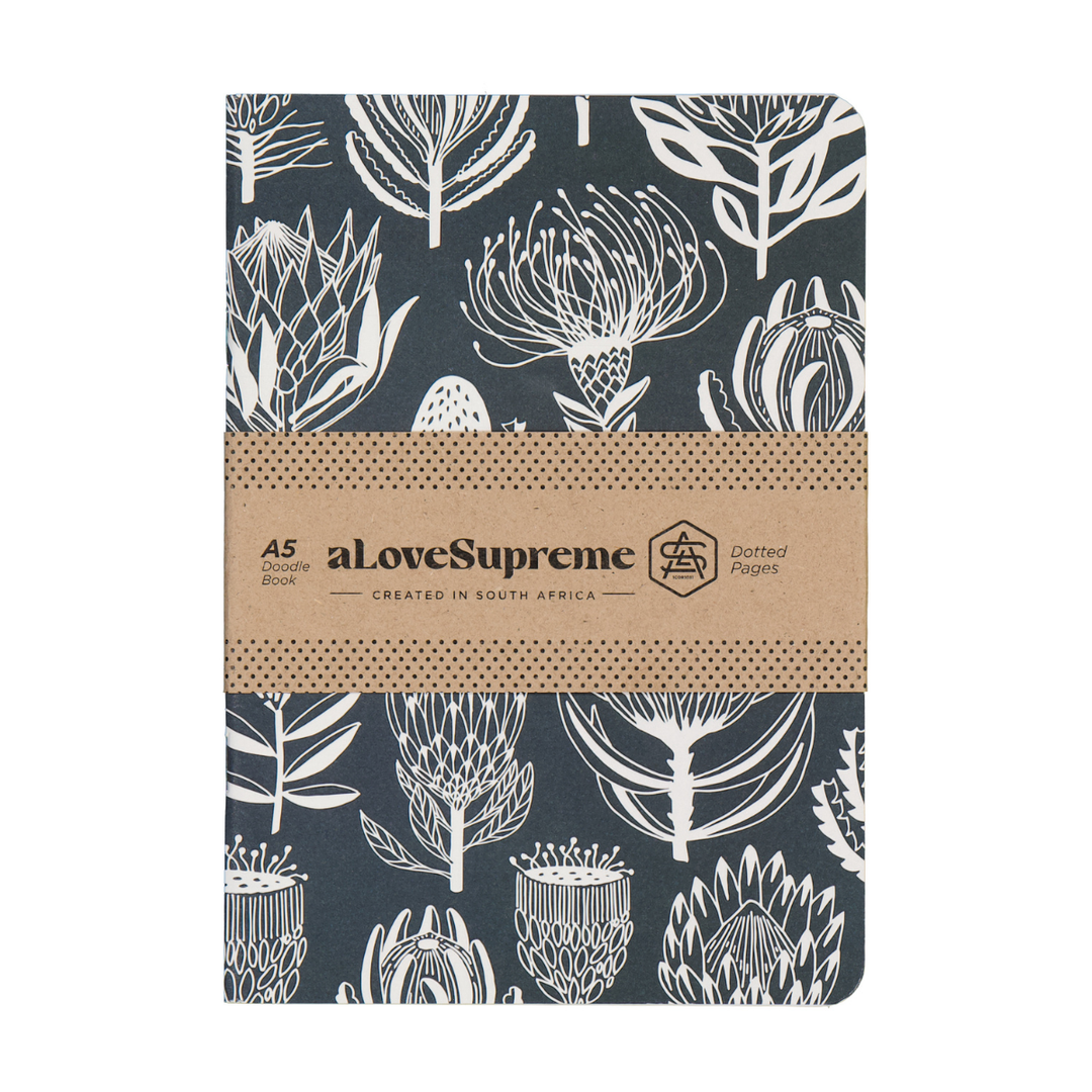Notebook with floral pattern and brown band featuring &