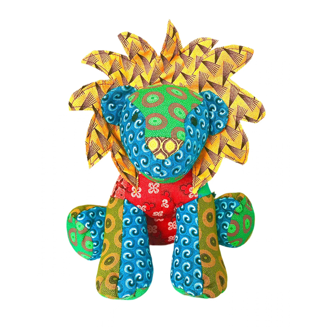 front of Lion Shweshwe Stuffed Toy, with colourful fabric on white background