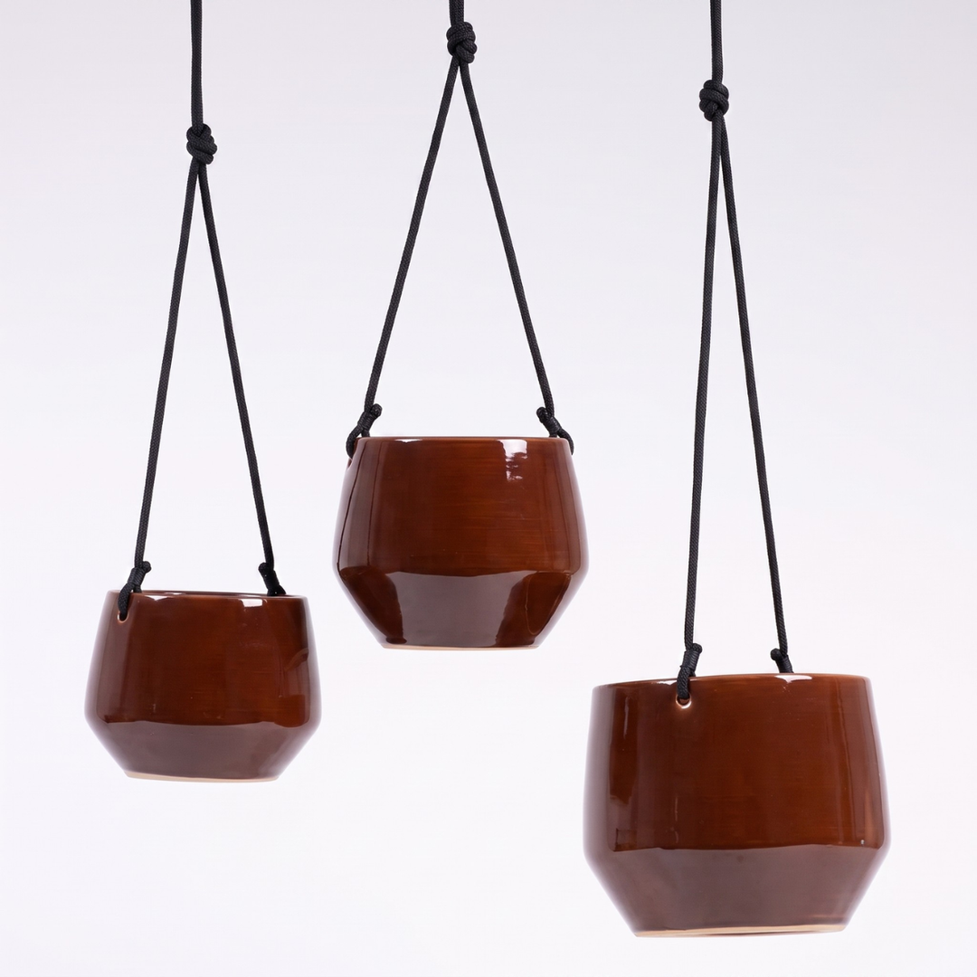 three sizes of Oxblood Red Hanging Planter by Plantify with black rope