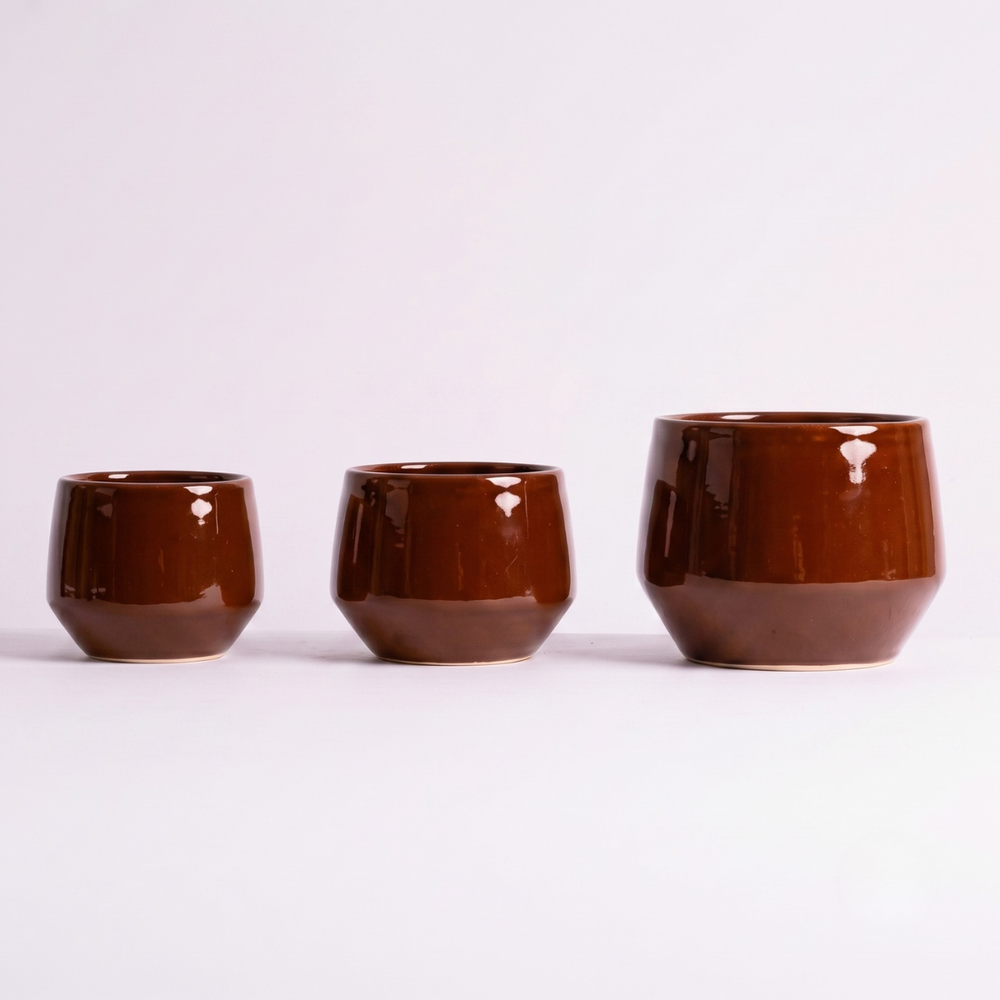 Trio of Oxblood red Planters for scale